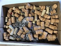 Large flat of wine corks & soda pull tabs