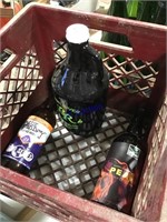 Milk crate with 3 brown bottles