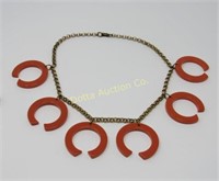 NECKLACE WITH 6 LARGE (2 IN.) C RINGS