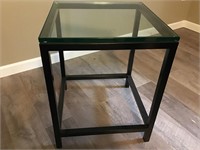 Metal frame glass top end table. 22.25”H x 18”W x