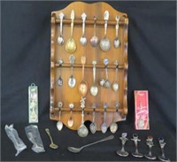 Souvenir spoons in display rack - 29 spoons