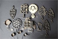 7 Cast Iron Trivets, Advertising Ashtray &  Stove