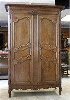 Early Louis XV Style Rosette Carved Oak Armoire.