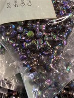 Two boxes of 10 mm propeller beads. Oil black