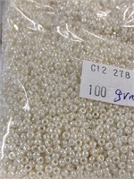 Toho 10/0 glass round seed beads. Luster ivory.