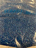 Toho 10/0 glass round seed beads. Light blue.