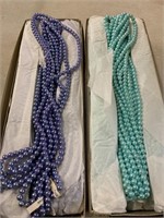 Plastic pearls. 72 strands in each box 24 inches