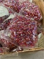 Plastic 10 mm propeller beads. One box ruby