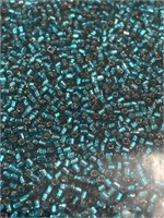 Toho 5/0X seed bead. Silver lined teal. Two boxes