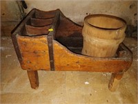 primitive wooden piece and bucket