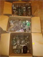 lot of coloured jars, bottles etc