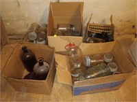 lot of mason jars , bottles , coloured jars