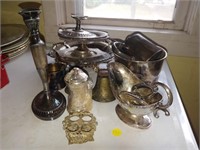 lot silver looking , candle holders , platters