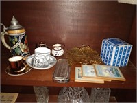 lot of beer stein, cups and saucers, coasters etc.