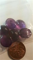 6 almost round polished amethysts