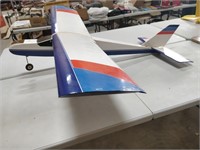 blue, red and white remote controlled plane