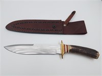 Fixed bladed knife with brass guard and threaded p