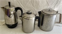 Three stainless steel coffee percolators, Two
