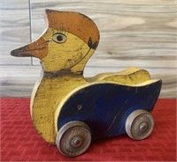 Antique wood duck on wheels