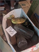 Box including glass jars and duck
