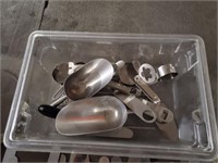 Assorted Scoops and Utensils in Clear Plastic Tub
