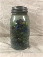 Vintage low shoulder blue ball mason jar full of