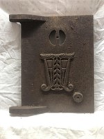 Vintage cast iron ornate wood stove door .