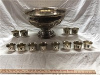 Vintage Silverplate punch bowl set . Has 12 cups .