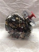 Vintage glass store jar full of buttons . Metal