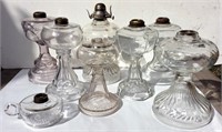 Seven clear glass oil lamps, 10 inch tall/ Finger