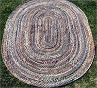 Oval hand braided wool rug,
