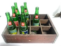 Vintage 7up bottles and wood carrier