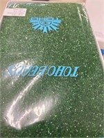 Toho 15/0 hex seed bead. Transparent Green. Two