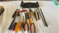 Various tools: screwdrivers, pliers, various