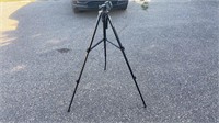 Camera tripod. One leg is bent and doesn’t go in