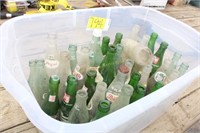 Tub of glass pop bottles
