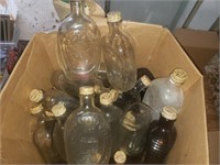 Large box of Log Cabin syrup bottles.