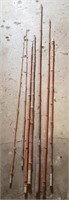 Vintage bamboo fishing poles.