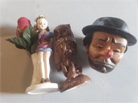 Figurines and plastic clown head.