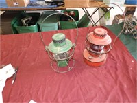 (2) lanterns, 1 with clear lens, 1 with red lens