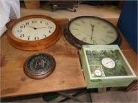 Group of round wall clocks & thermometers