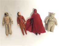 Vintage Star Wars action figures and blaster