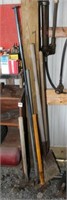 Lot of long handled tools to include a post iron/