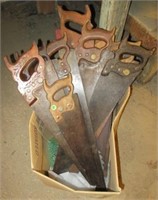 Large group of hand saws.