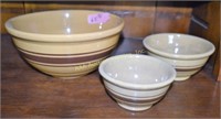 3 brown banded yellow ware mixing bowls. Fine hair