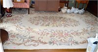 Large hooked area rug. Dimensions: 168" x 119"