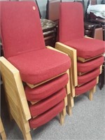 8 more red wood framed stacking chairs