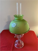 Oil lamp with hand painted green glass shade,