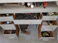 Old desk loaded with electrical parts