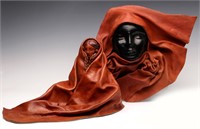 A PAIR OF DRAPED LEATHER SCULPTURES